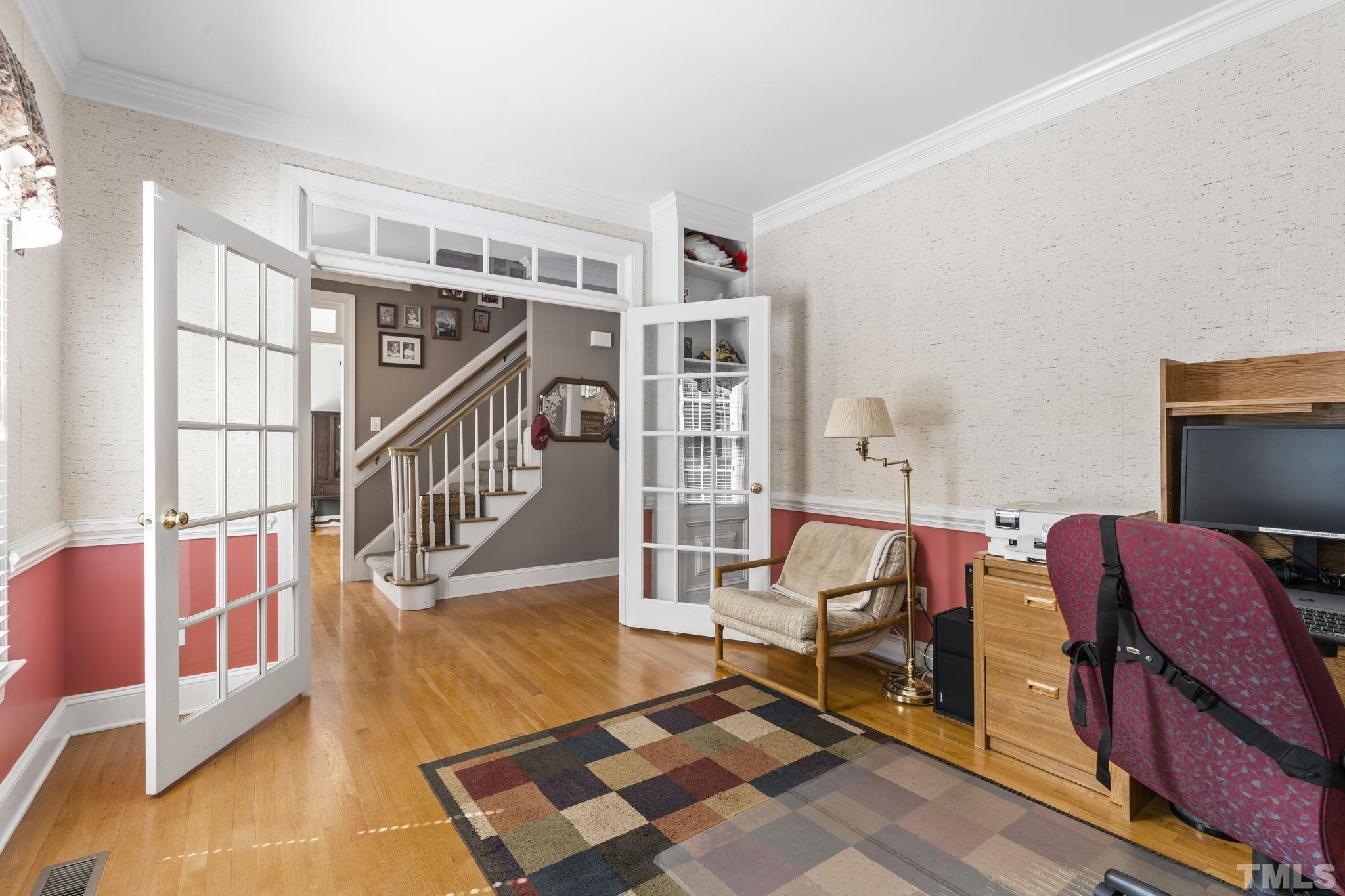 7705 Tylerton Drive Raleigh, NC 27613 - Photo 4 of 35 a living room with furniture and wooden floor