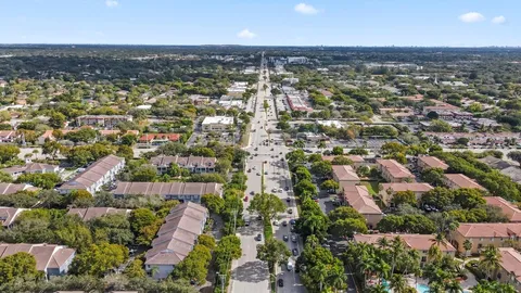 an aerial view of residential building with parking space