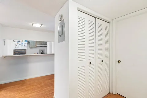a view of kitchen with hallway