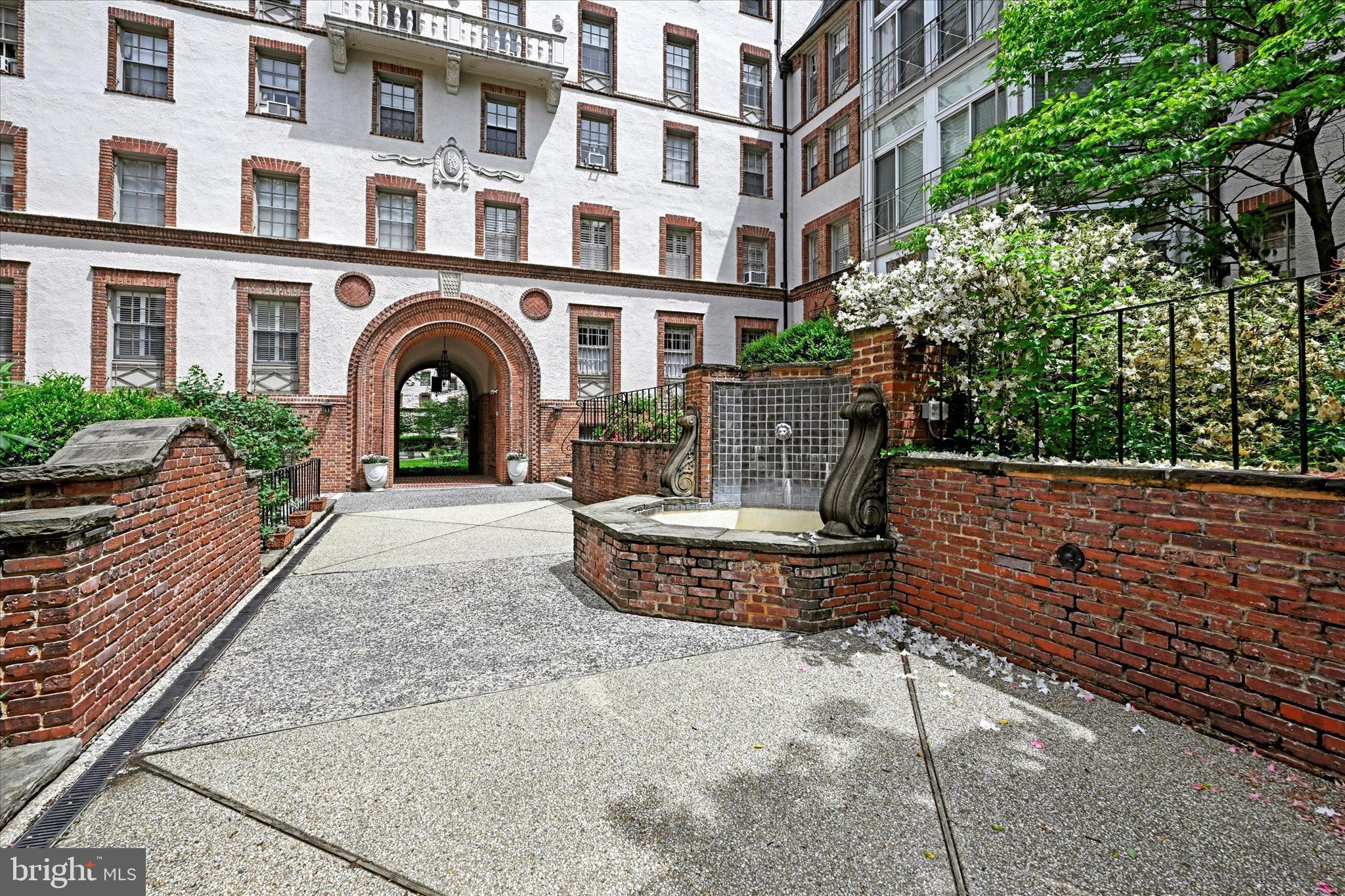 6 Upland Road, Unit Q3 Baltimore, MD 21210 - Photo 2 of 27 a front view of a multi story building with yard
