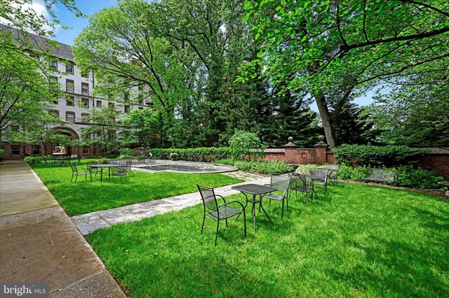 a view of yard with seating area and trees