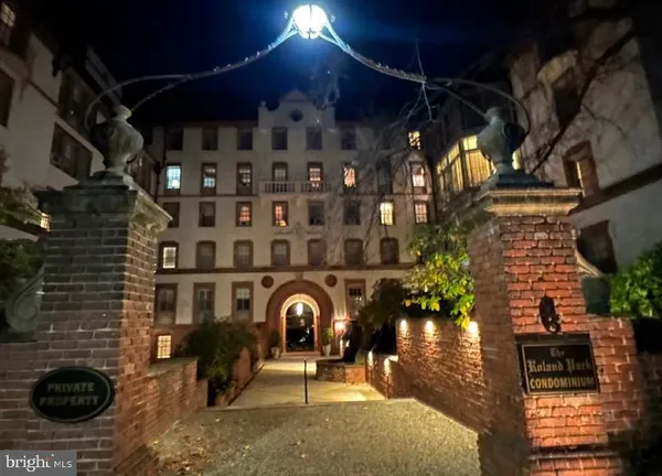 a view of a porch with a table and chairs
