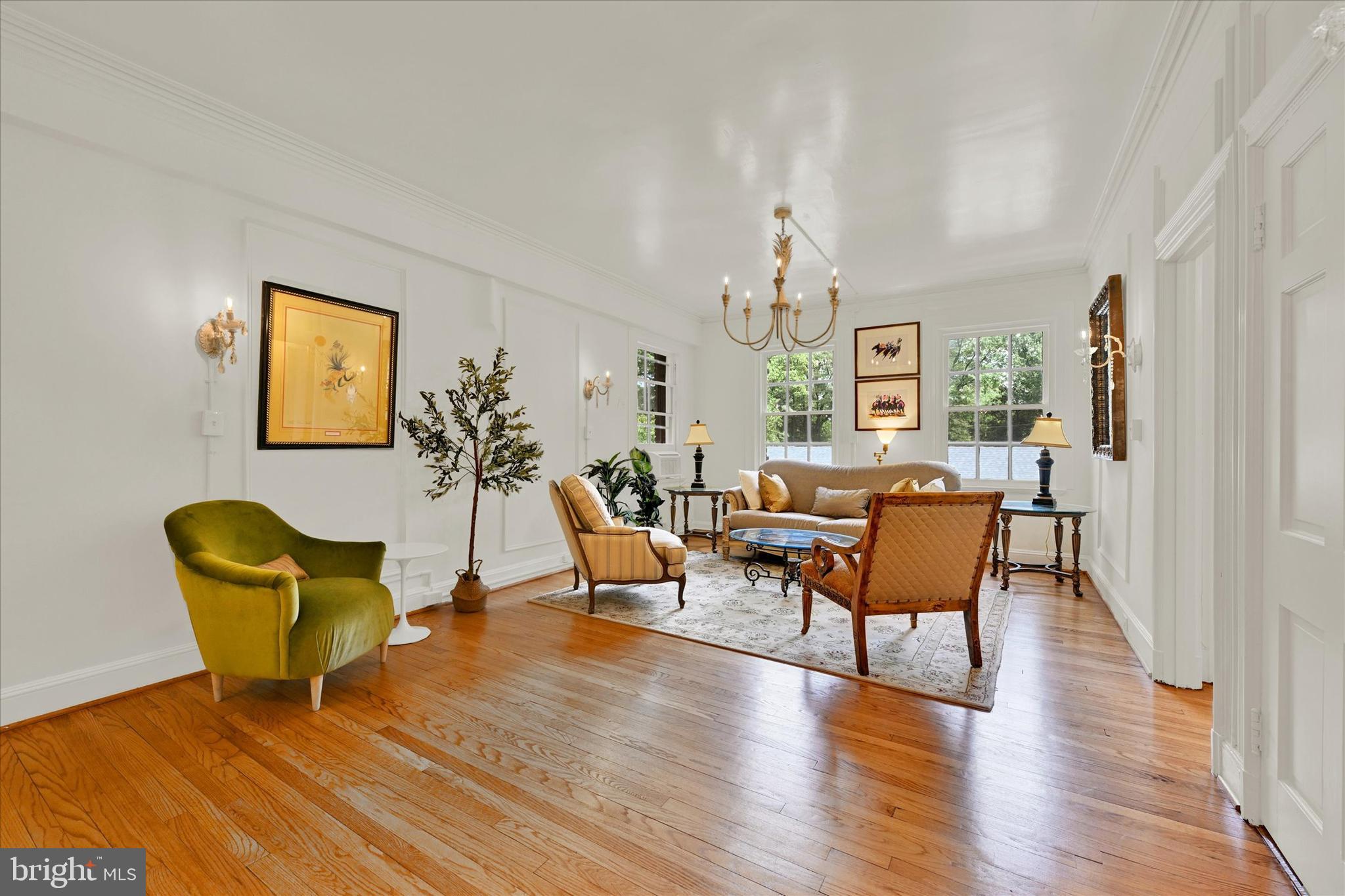 6 Upland Road, Unit Q3 Baltimore, MD 21210 - Photo 7 of 27 a living room with furniture a chandelier and wooden floor