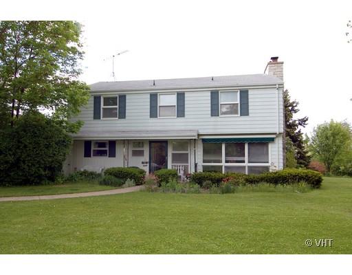 34W556 Country Club Road Wayne, IL 60184 - Photo 1 of 1 a front view of a house with garden