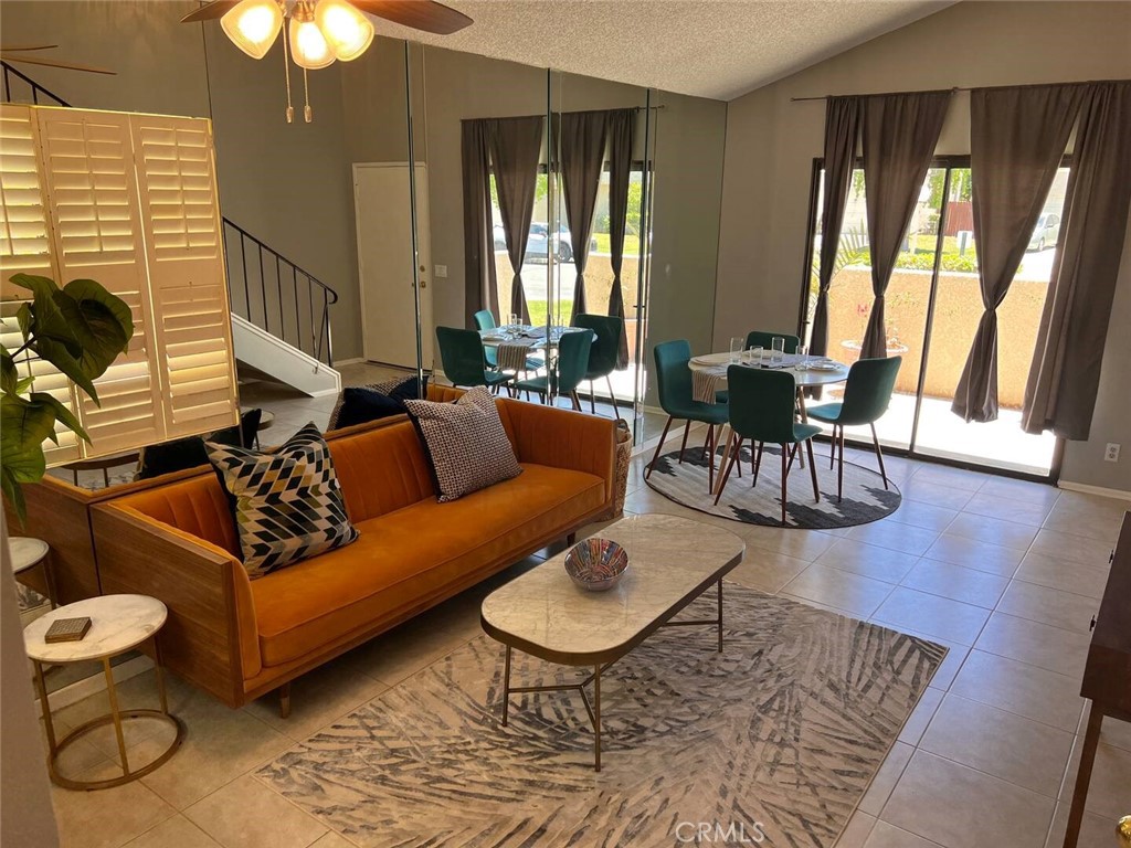 69646 Antonia Way Rancho Mirage, CA 92270 - Photo 11 of 50 a living room with furniture and a large window
