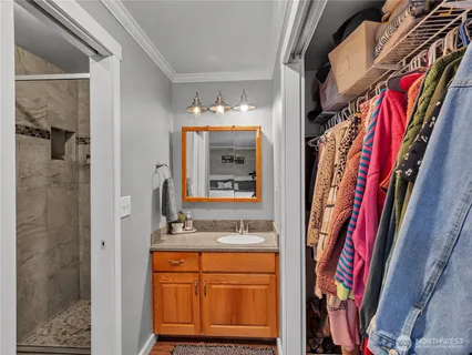 a bathroom with a bathtub and a mirror
