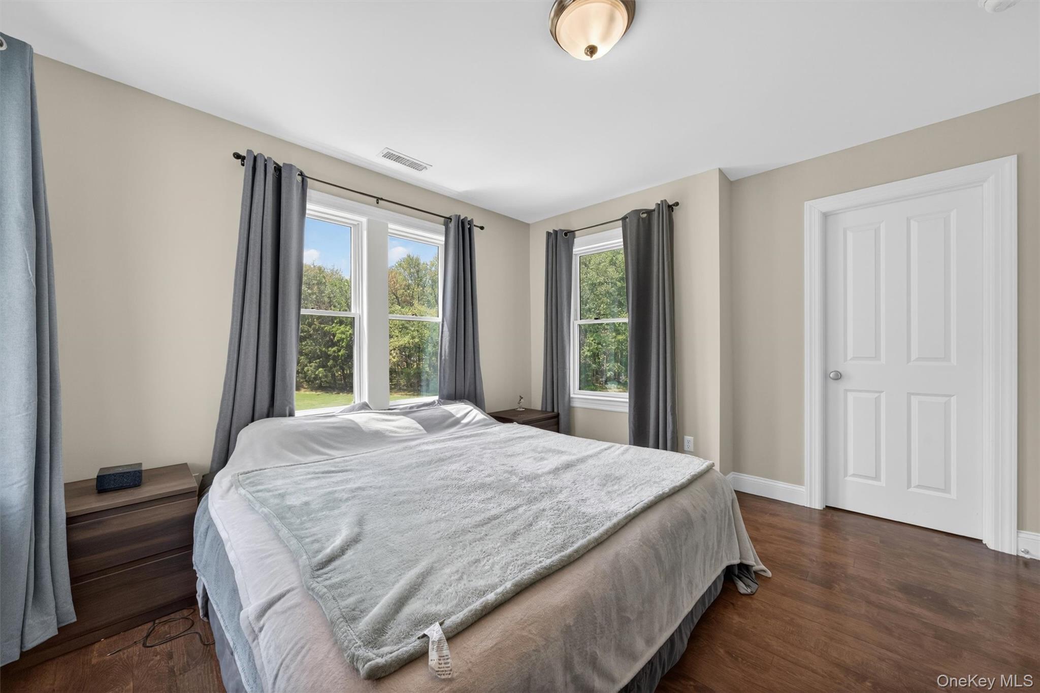28 Bethlehem Road New Windsor, NY 12553 - Photo 41 of 50 a large bed sitting in a bedroom next to a window