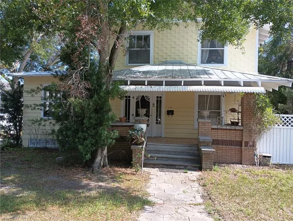 front view of a house with a yard