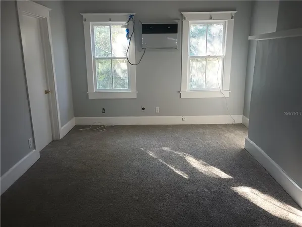 an empty room that has a window