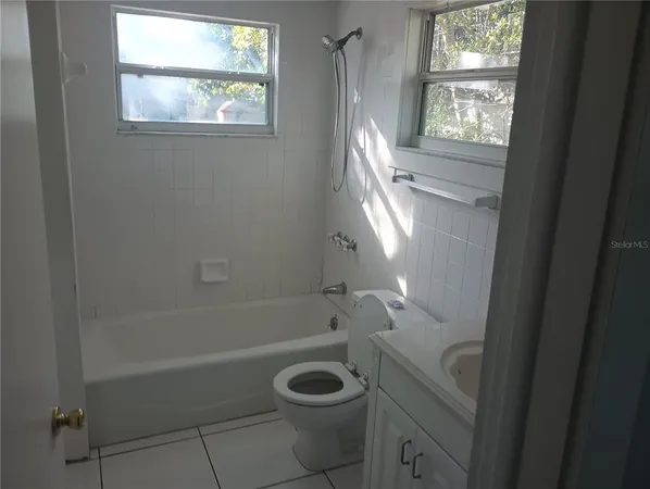 a bathroom with a toilet and a bathtub