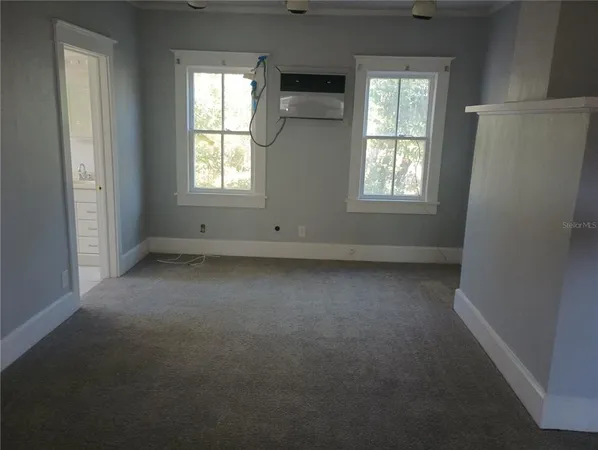 an empty room with windows