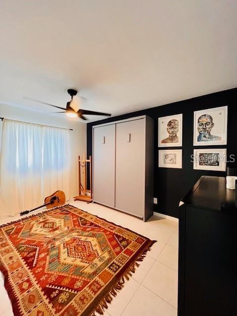 10172 63rd Avenue North Seminole, FL 33772 - Photo 14 of 24 a bedroom with a bed and a desk