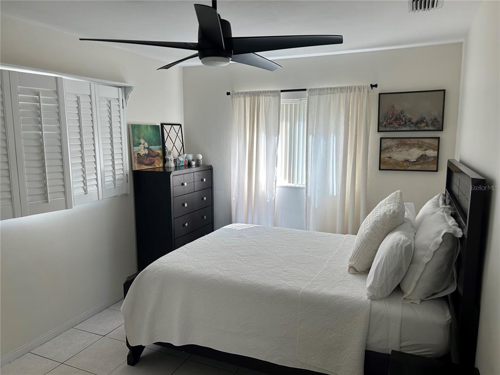 10172 63rd Avenue North Seminole, FL 33772 - Photo 20 of 24 a bedroom with a bed and a window