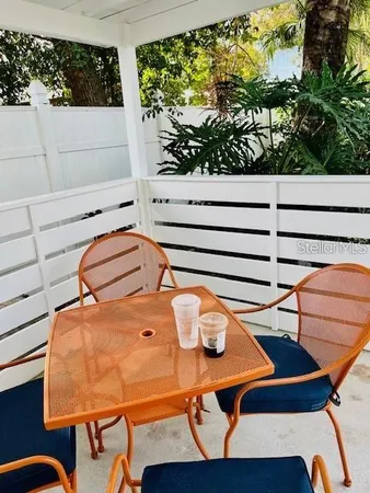 a swimming pool with outdoor seating and yard