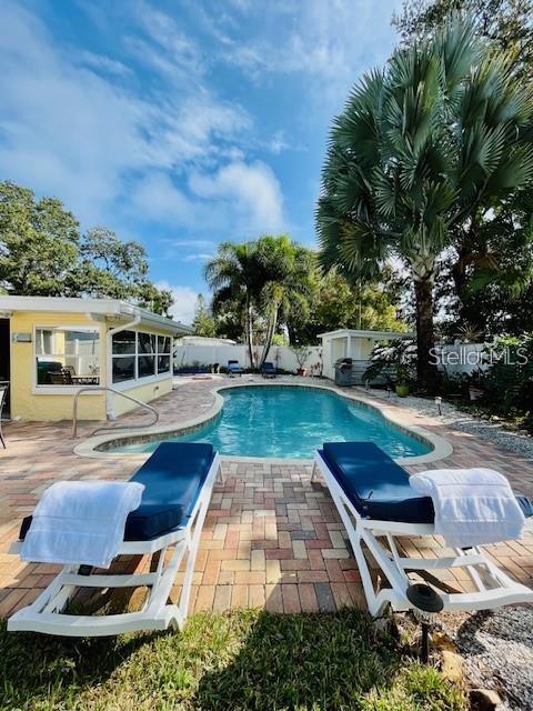 10172 63rd Avenue North Seminole, FL 33772 - Photo 23 of 24 a swimming pool with outdoor seating and yard