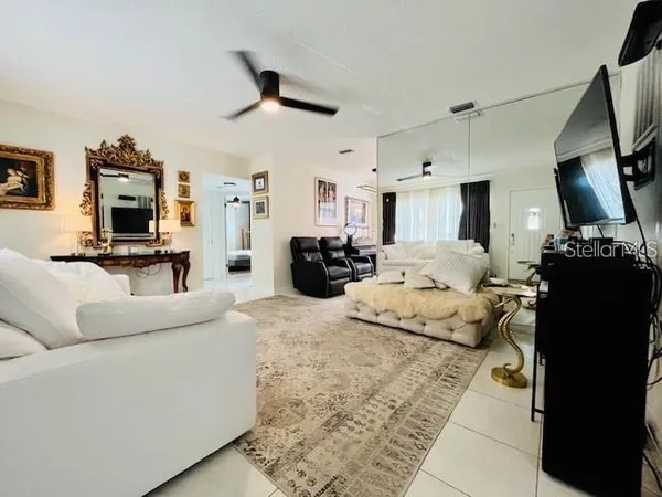 a living room with furniture and a window