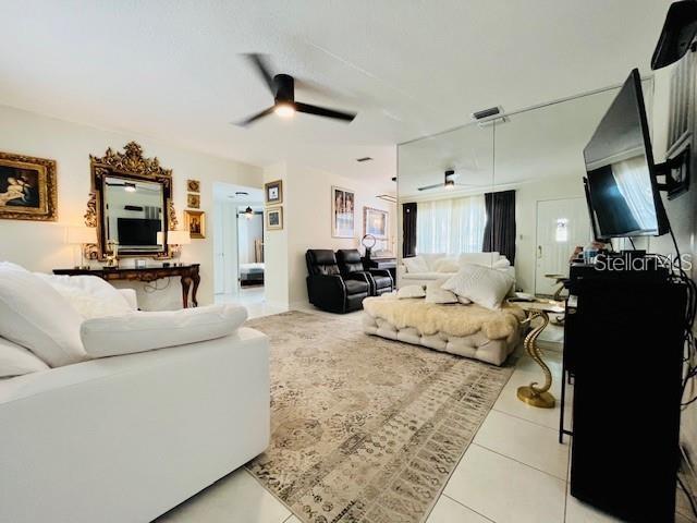 10172 63rd Avenue North Seminole, FL 33772 - Photo 3 of 24 a living room with furniture and a flat screen tv