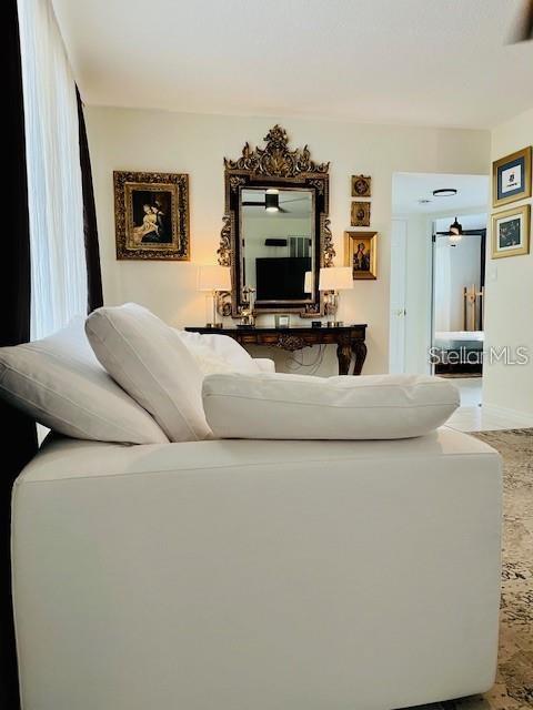 10172 63rd Avenue North Seminole, FL 33772 - Photo 5 of 24 a living room with furniture and a flat screen tv