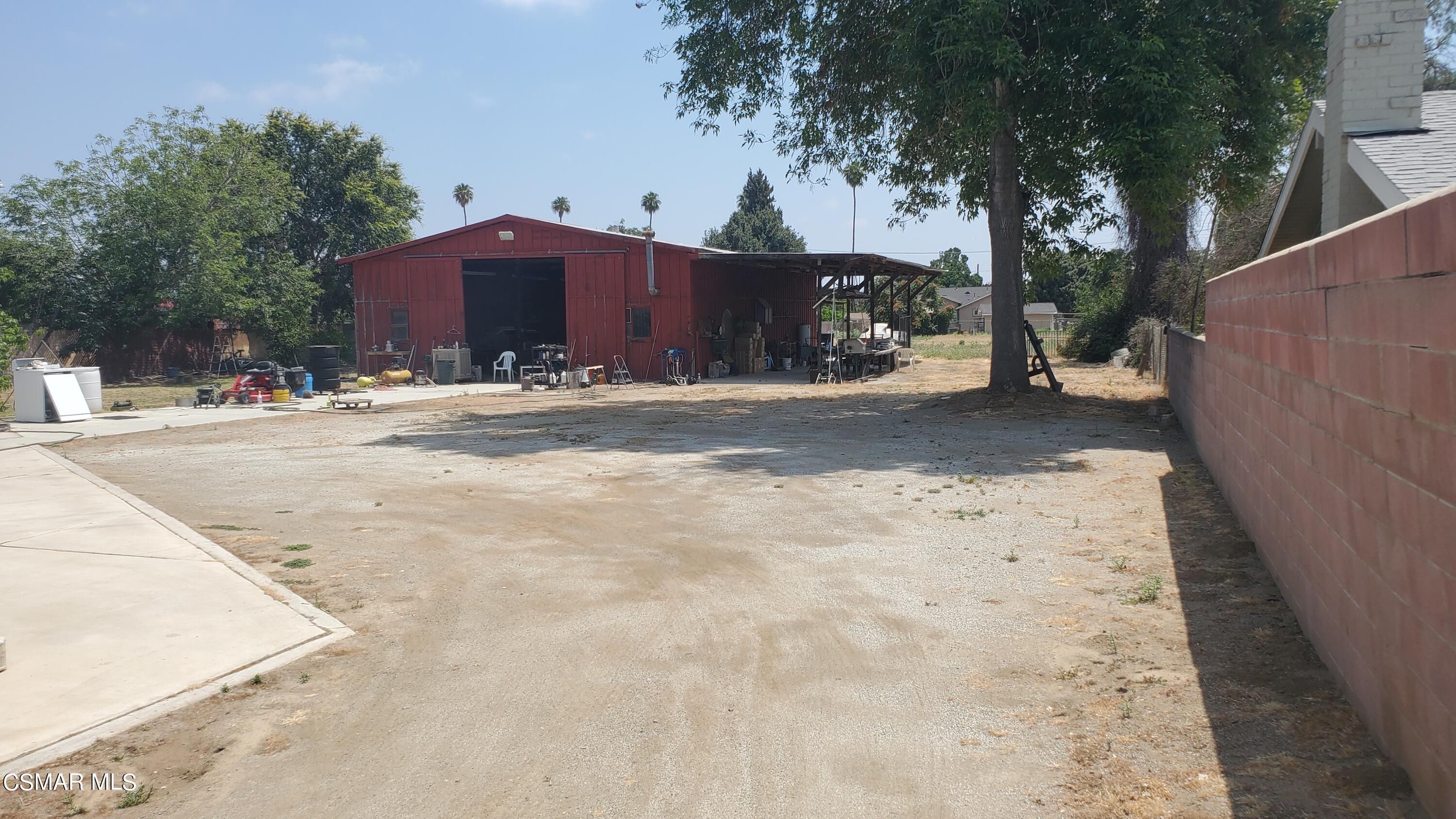 5622 Jurupa Avenue Riverside, CA 92504 - Photo 3 of 9 a view of a yard and a house