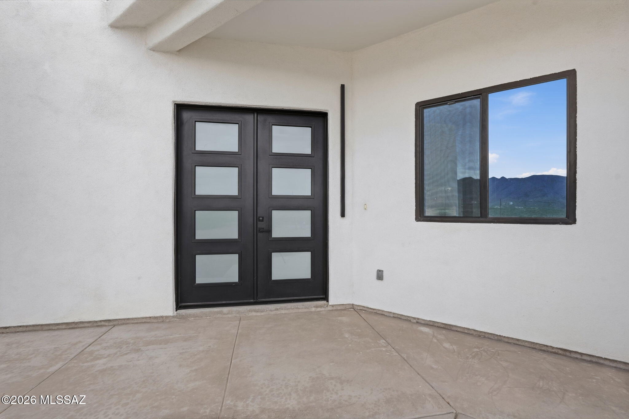 1786 Peralta Court Rio Rico, AZ 85648 - Photo 7 of 50 a view of an empty room with a window