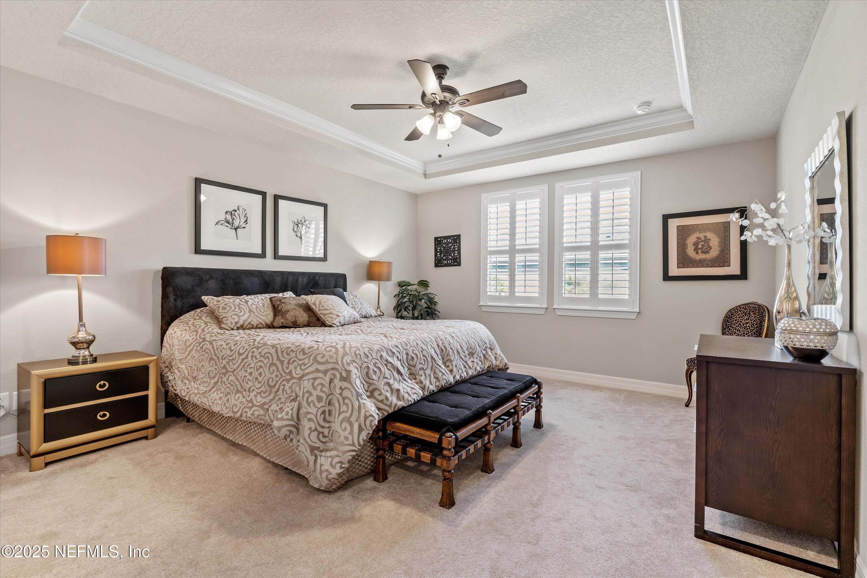 440 Winding Path Drive Ponte Vedra, FL 32081 - Photo 20 of 35 a spacious bedroom with a bed and a couch
