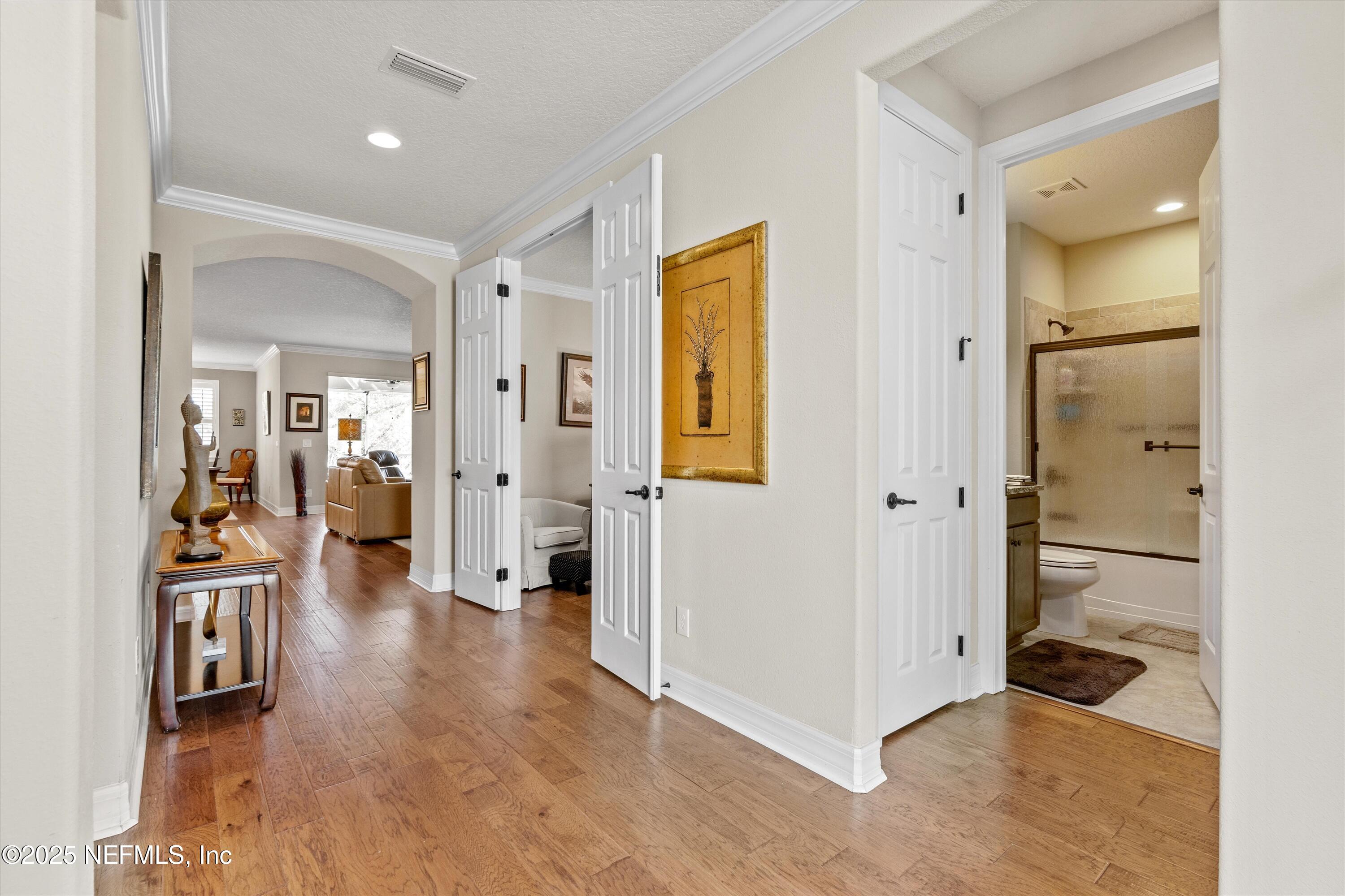 440 Winding Path Drive Ponte Vedra, FL 32081 - Photo 2 of 35 a view of a hallway with wooden floor windows and a livingroom