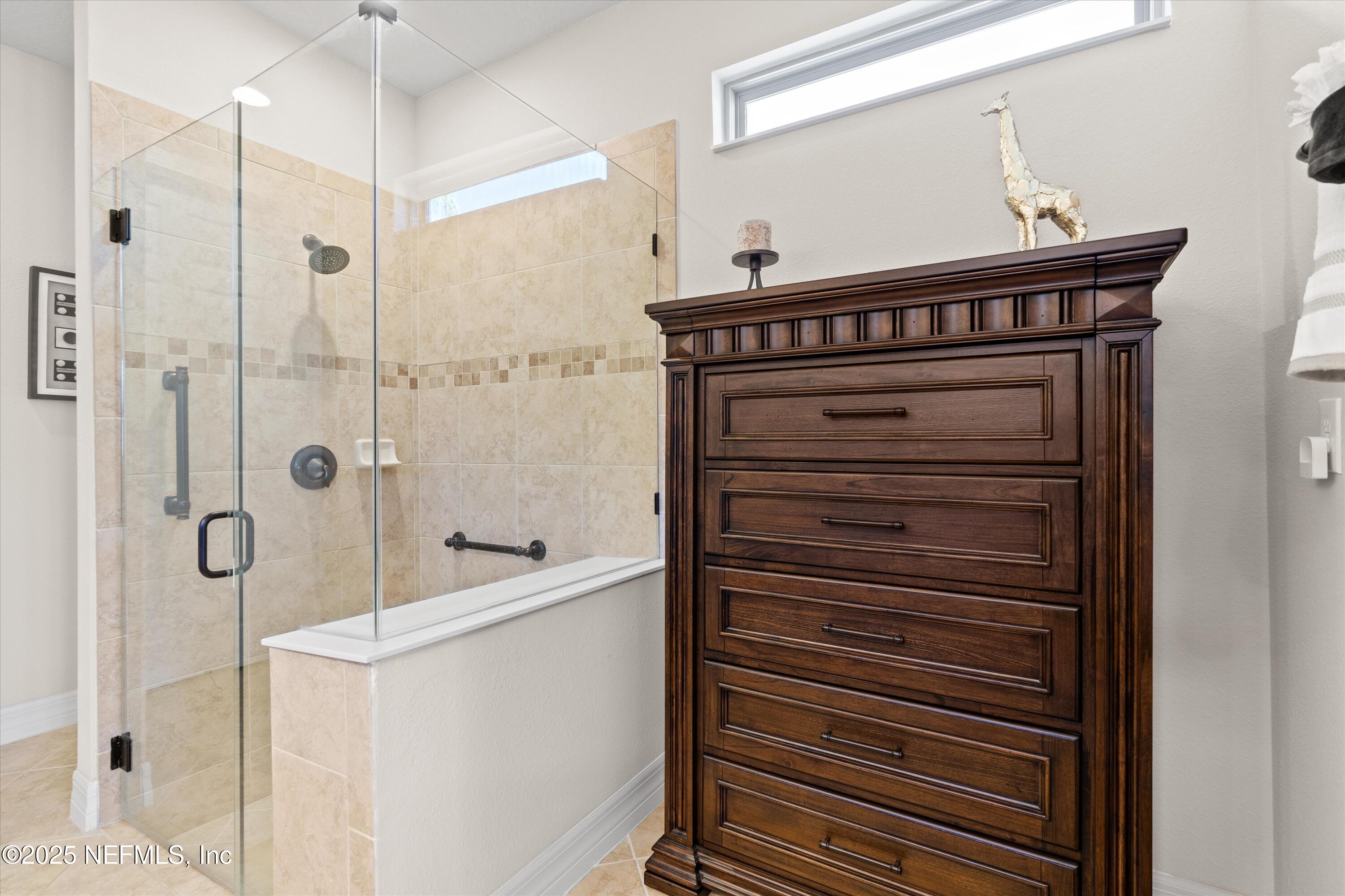 440 Winding Path Drive Ponte Vedra, FL 32081 - Photo 24 of 35 a bathroom with a shower and a sink