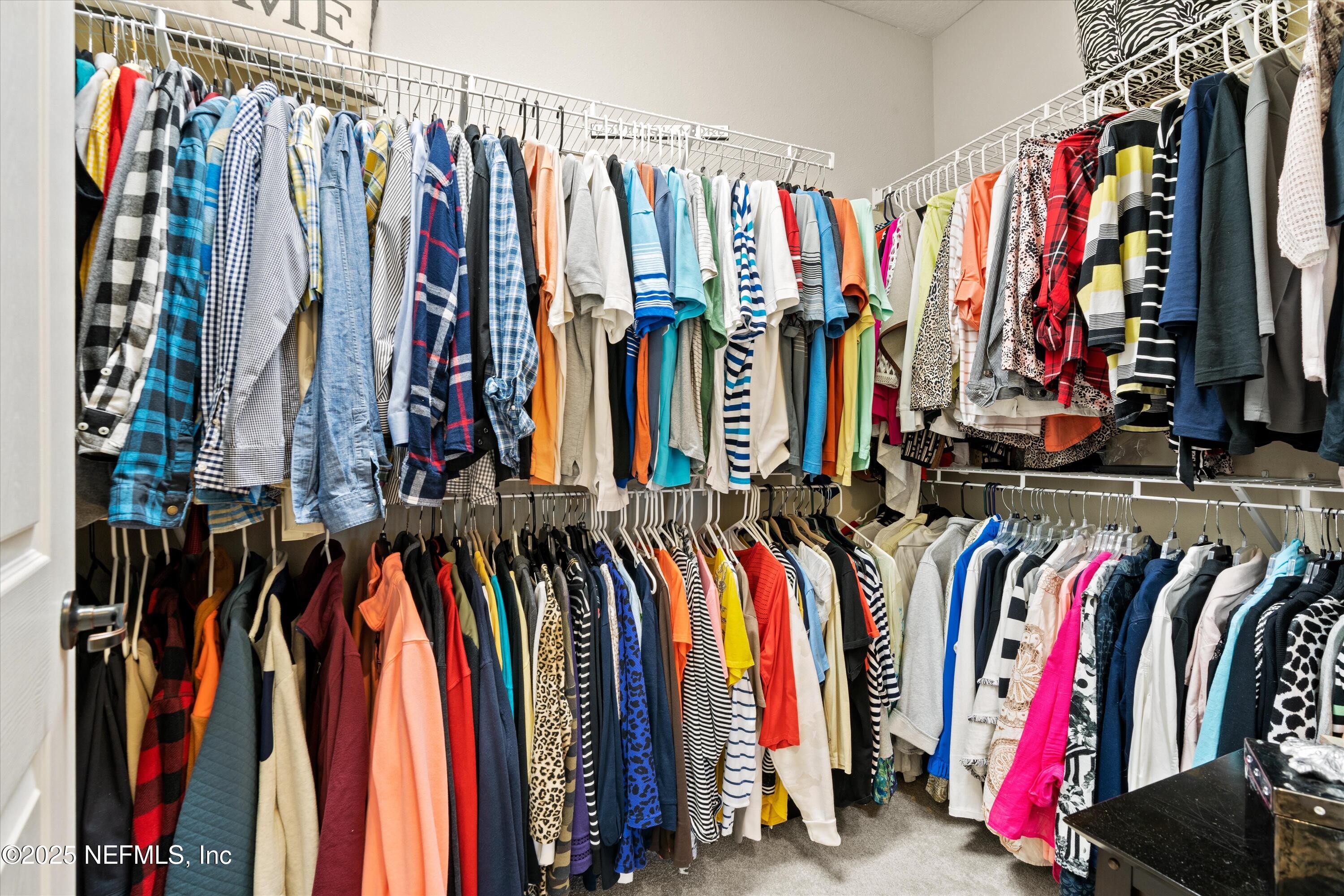 440 Winding Path Drive Ponte Vedra, FL 32081 - Photo 25 of 35 a view of walk in closet with clothes