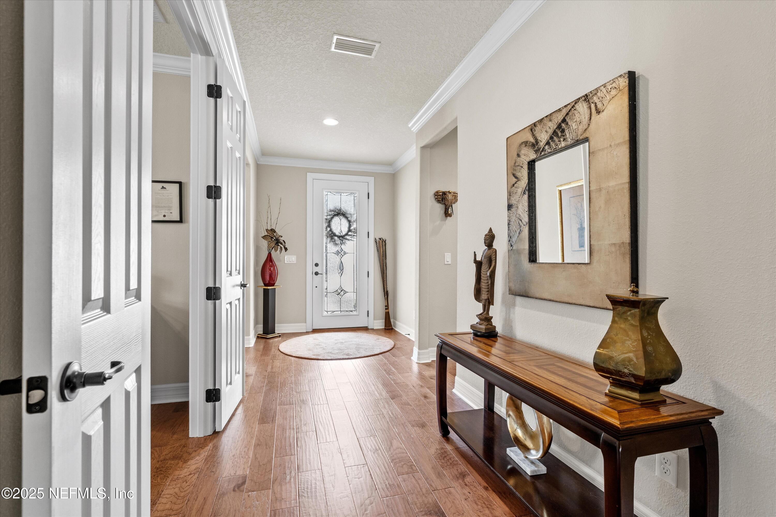 440 Winding Path Drive Ponte Vedra, FL 32081 - Photo 6 of 35 a view of hallway with furniture and wooden floor