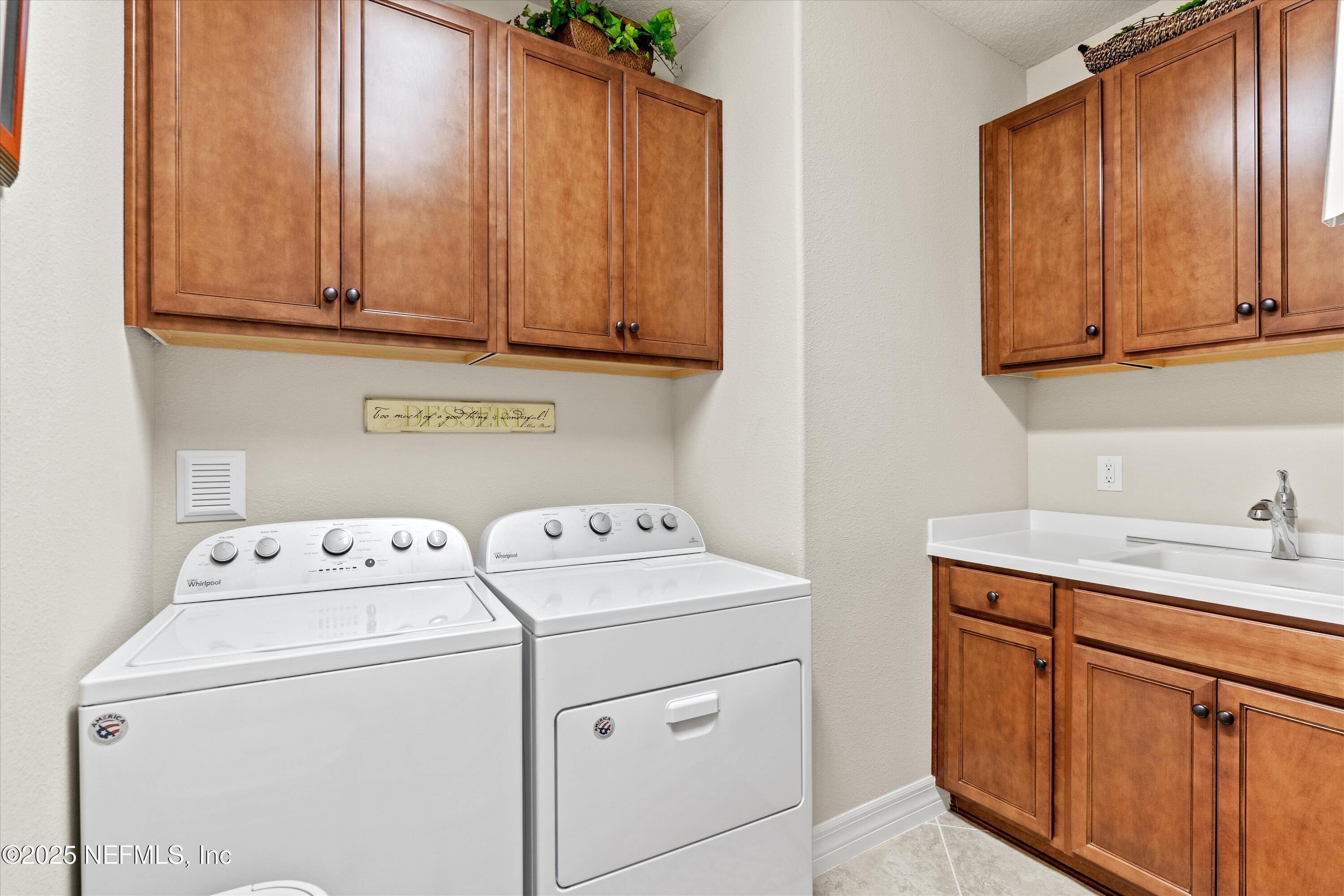 440 Winding Path Drive Ponte Vedra, FL 32081 - Photo 8 of 35 a utility room with dryer and washer