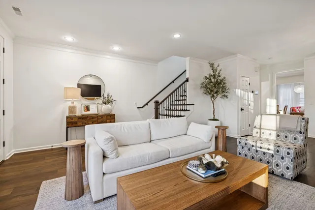a living room with a fireplace and a flat screen tv