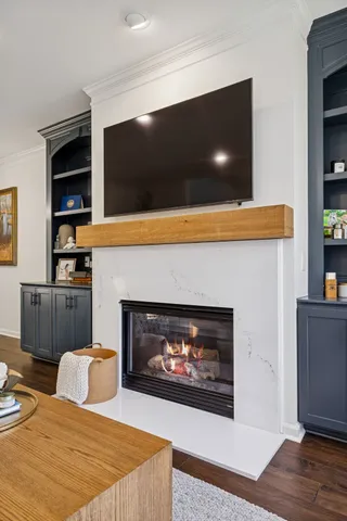 a view of a livingroom with a furniture wooden floor and a ceiling fan