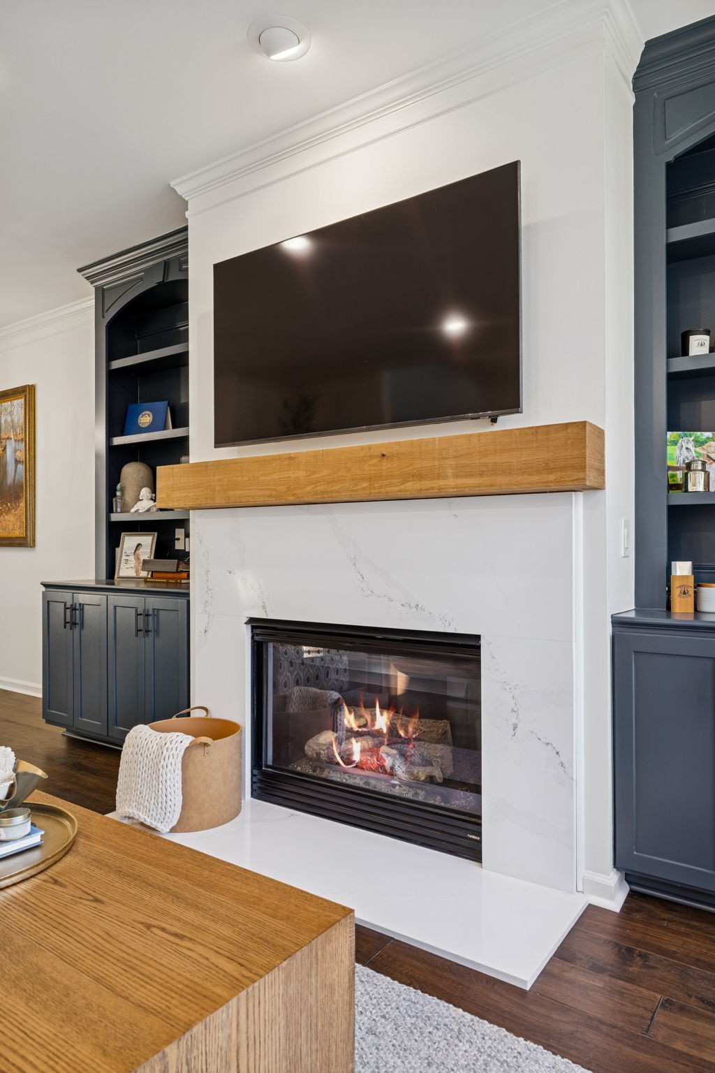 102 Pearl Street Franklin, TN 37064 - Photo 14 of 71 a living room with a fireplace and a flat screen tv