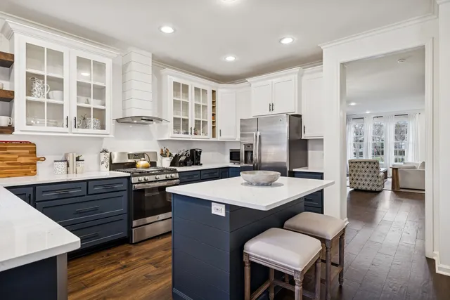 a kitchen with stainless steel appliances granite countertop a stove and a sink