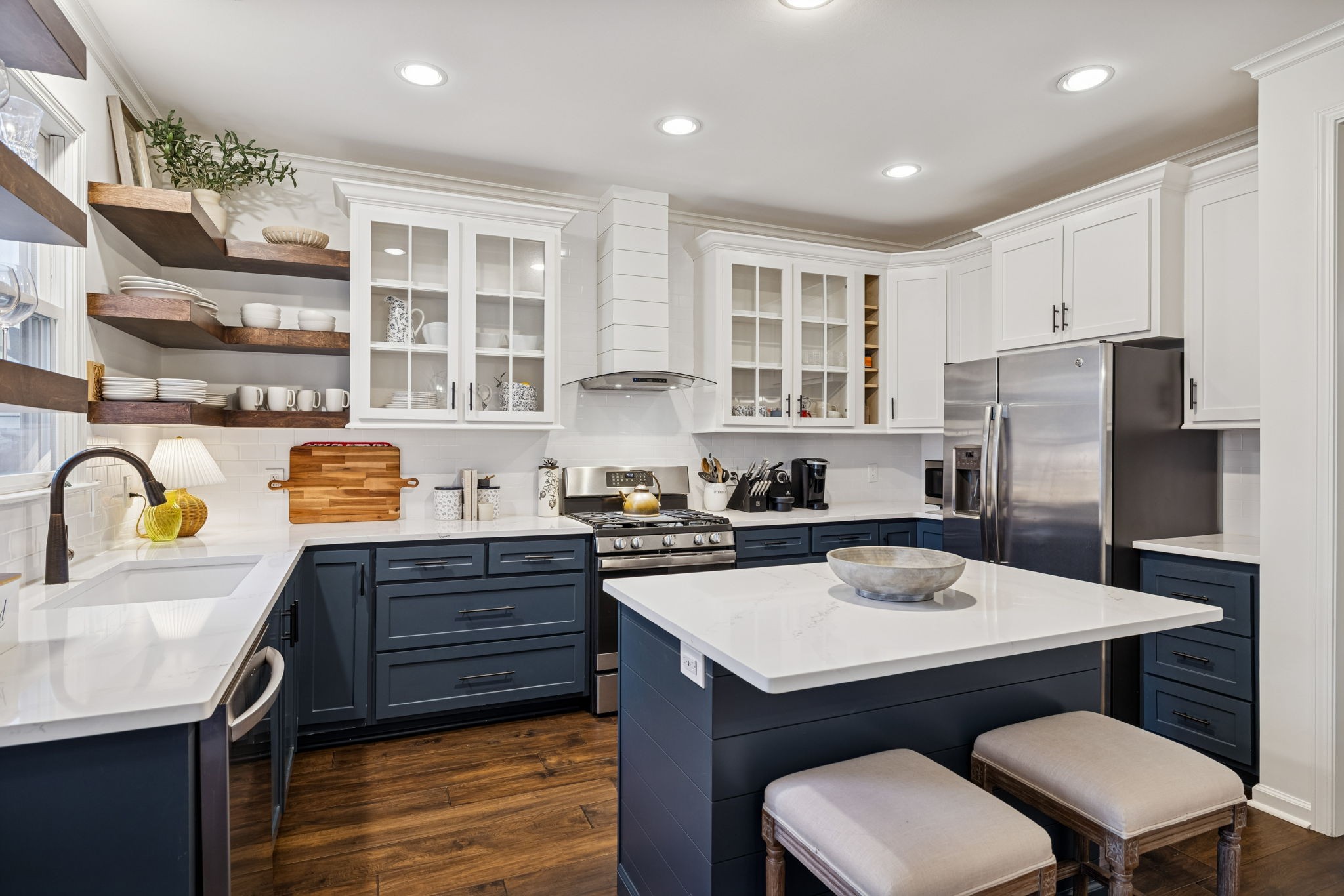 102 Pearl Street Franklin, TN 37064 - Photo 29 of 71 a kitchen with a refrigerator a stove a sink dishwasher with a dining table and chairs