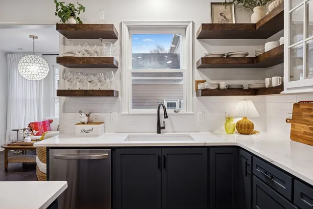 a bedroom with a bed and a lamp