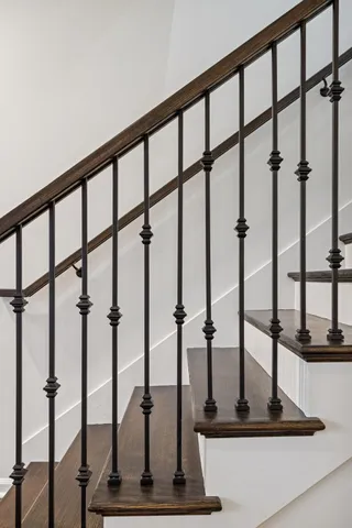 a bedroom with a bed window and a desk