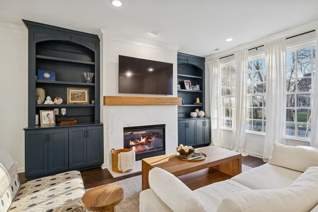 a bedroom with furniture and a book shelf