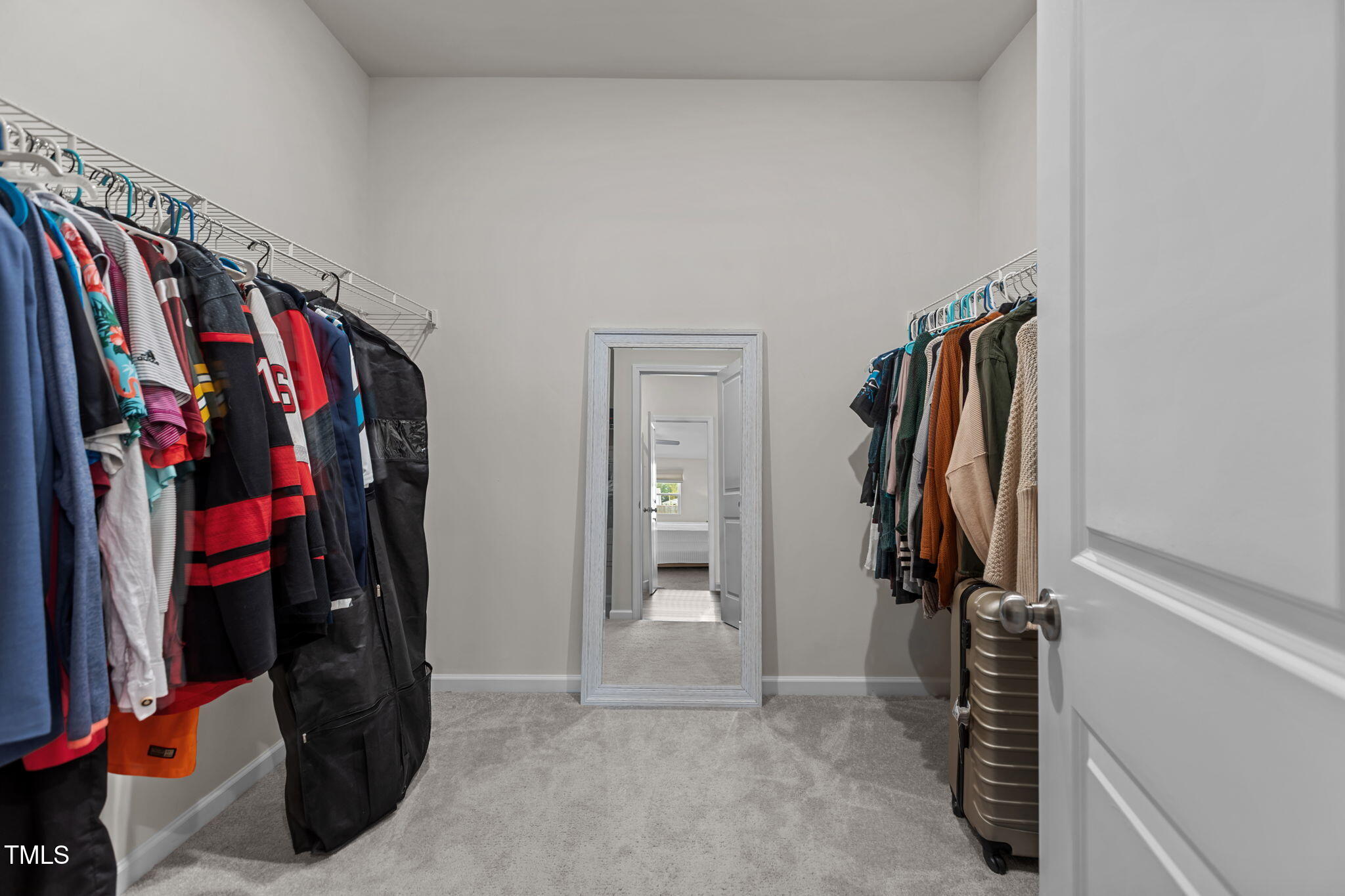 3521 Strawberry Patch Row Raleigh, NC 27604 - Photo 26 of 38 a view of walk in closet with clothes and shoes