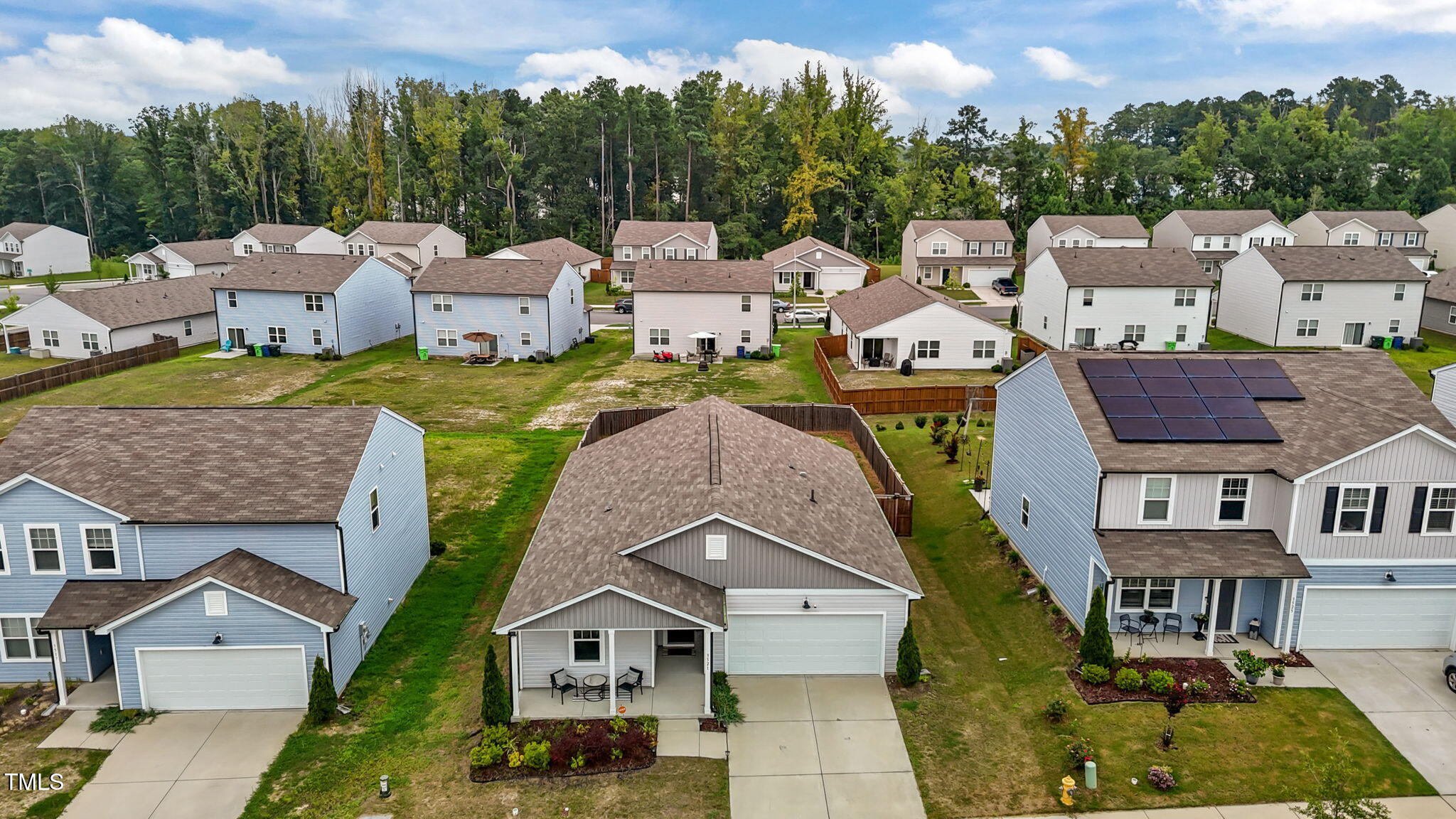 3521 Strawberry Patch Row Raleigh, NC 27604 - Photo 35 of 38 an aerial view of a house with garden space and a car parked in front of it
