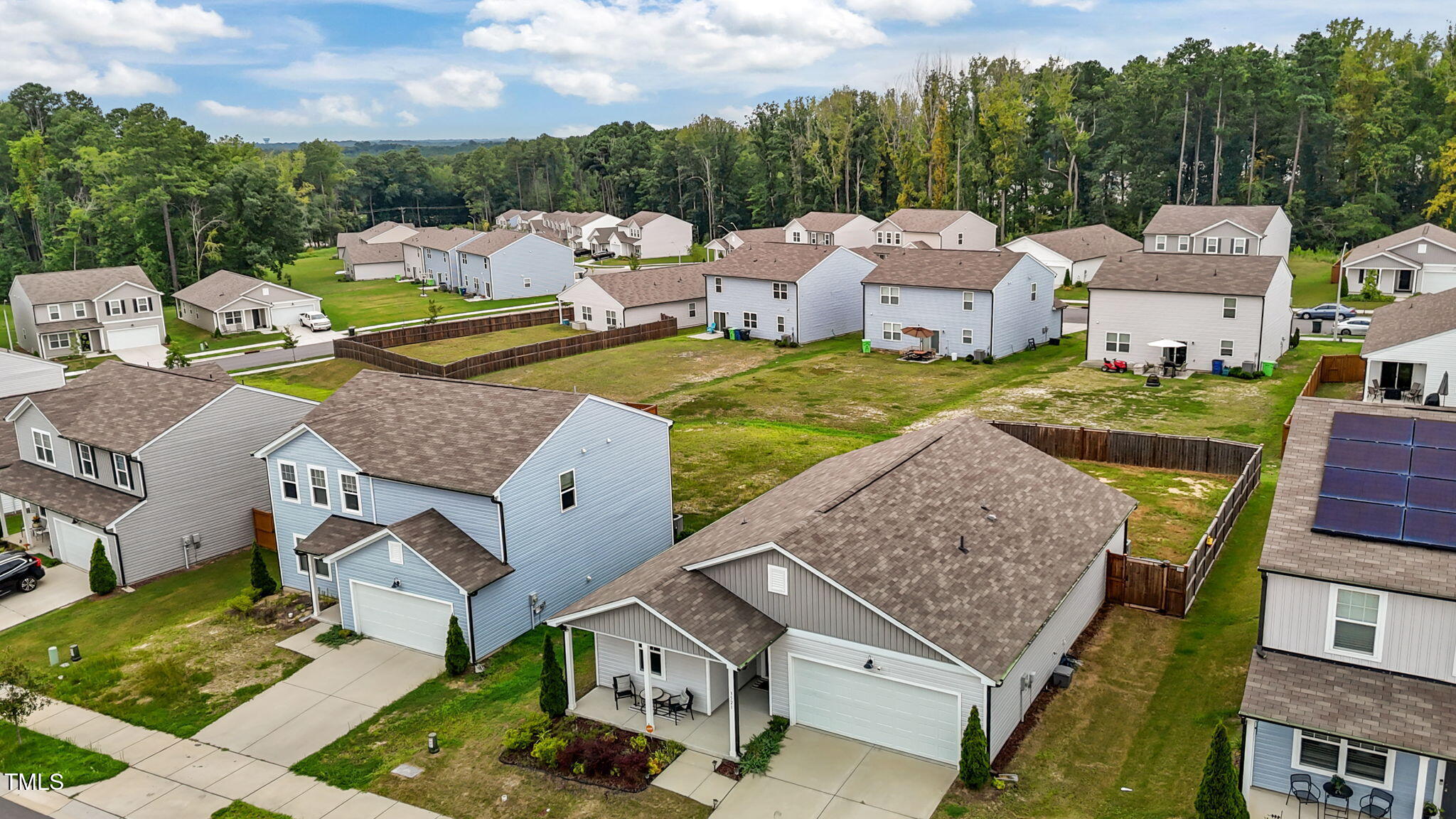 3521 Strawberry Patch Row Raleigh, NC 27604 - Photo 36 of 38 an aerial view of a house with garden space and houses