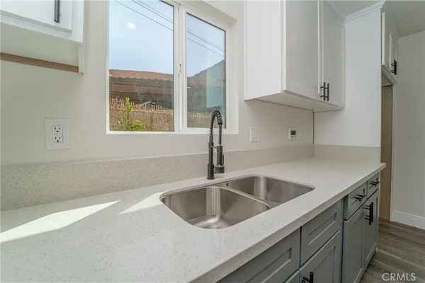 a kitchen with a sink and cabinets