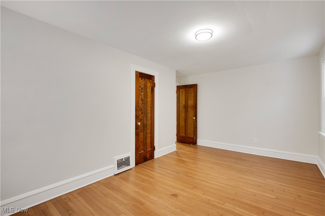 2016 Rossmoor Road Cleveland Heights, OH 44118 - Photo 35 of 46 Spare room with light wood-type flooring and baseboards