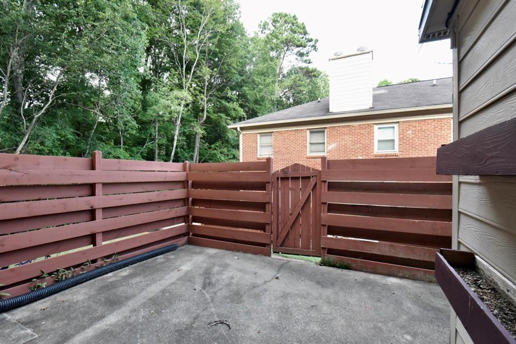 2898 Webb Bridge Road Alpharetta, GA 30009 - Photo 7 of 8 a view of a house with a backyard space
