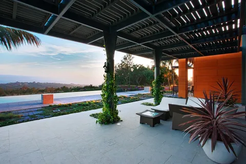 a view of a backyard with sitting area