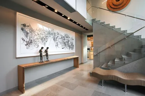 a view of entryway wih livingroom and stairs