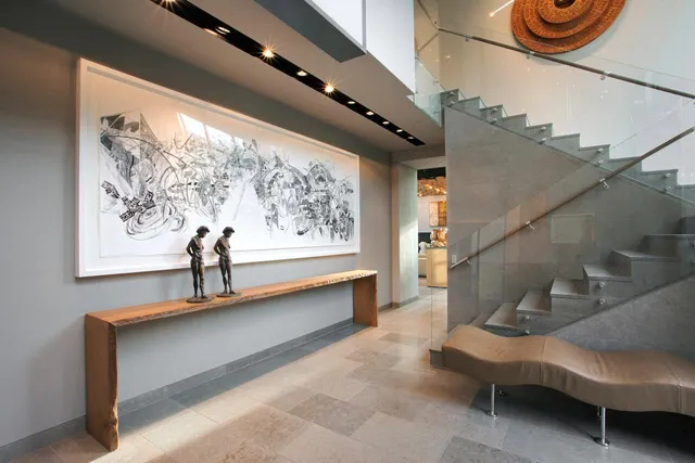 a view of entryway wih livingroom and stairs