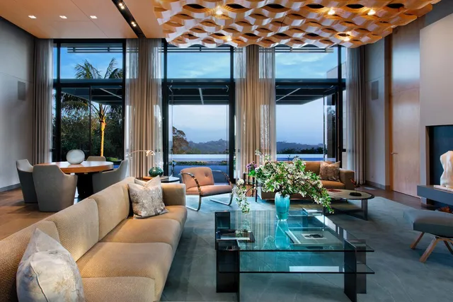 a living room with furniture and a potted plant