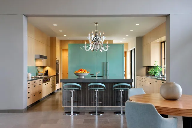 a kitchen with a table and chairs