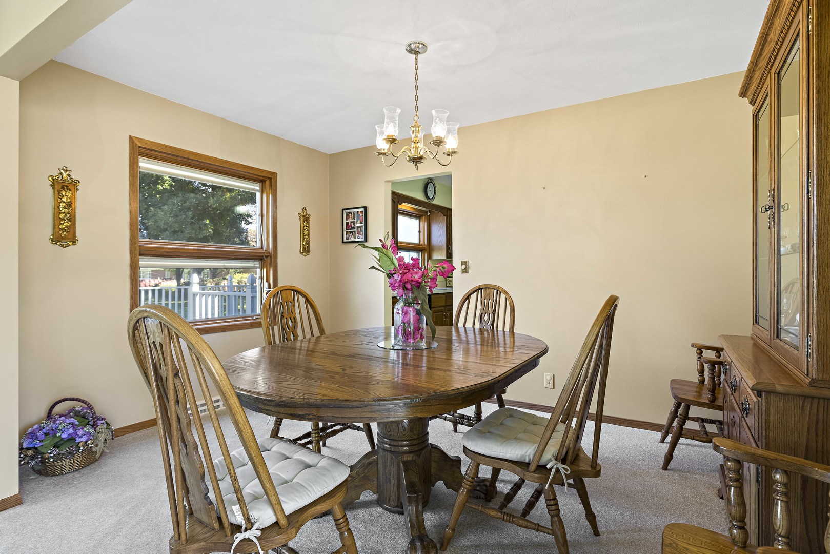 305 Ridge Road Rochelle, IL 61068 - Photo 7 of 31 a dining room with furniture potted plants and wooden floor